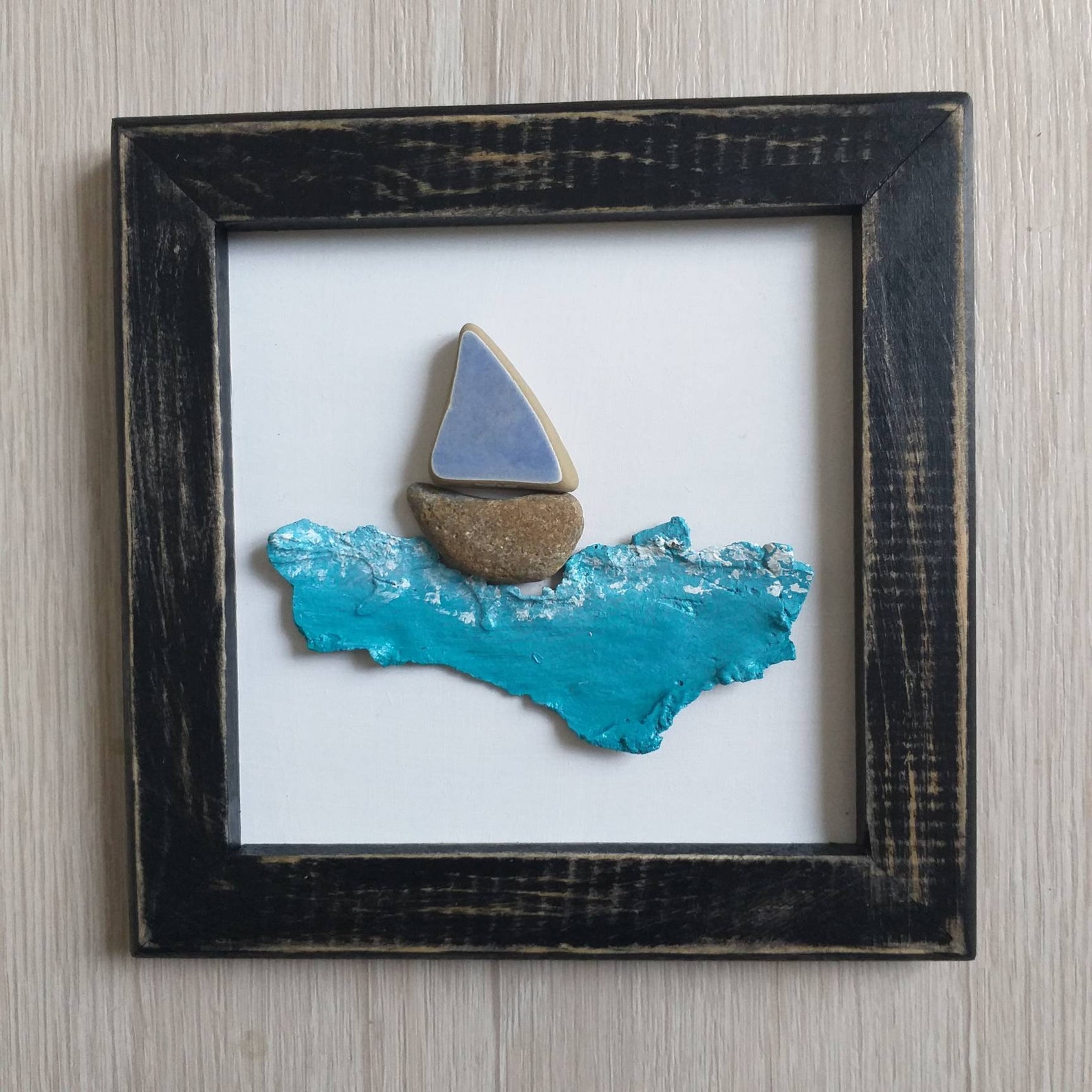 sailboat pebble art