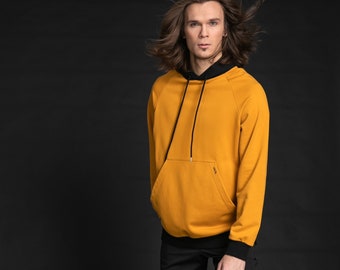 Bright Sweatshirt with Hood, Extended Sleeves and Enlarged Front Pocket