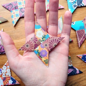 12pc Hand-Folded Origami Ninja Stars: Colorful Japanese Paper Party Favors