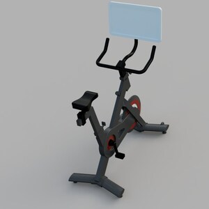Puede incluir: Una bicicleta de ejercicio est&aacute;tica negra con una pantalla unida al manillar. La bicicleta tiene un asiento negro y detalles rojos en los pedales.