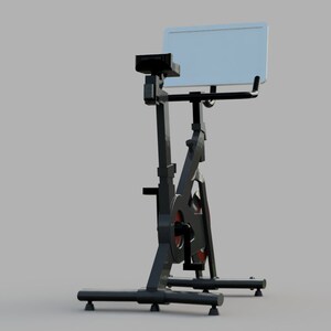 Puede incluir: Bicicleta de ejercicio est&aacute;tica negra con un soporte para tableta blanco. La bicicleta tiene un sill&iacute;n y un manillar negros, y una rueda roja y negra.