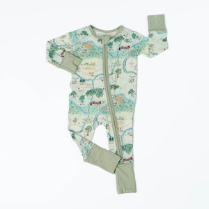 May include: A green and white long-sleeved baby sleeper with a map print and a zipper down the front. The sleeper has green cuffs and a green bottom.