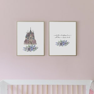 May include: Two framed prints with watercolor illustrations of a castle and a bouquet of purple flowers. The text on the print reads "Only the act of true love will thaw a frozen heart."