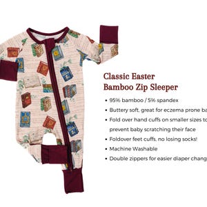 May include: A light pink bamboo zip sleeper with a book pattern. The sleeper has a burgundy zipper, cuffs, and foot cuffs. The sleeper has fold-over hand cuffs and double zippers for easy diaper changes.