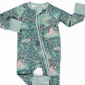 May include: A green, long-sleeved, zippered sleeper with a whimsical map print featuring castles, trees, and a winding path.