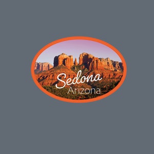 May include: A red, orange, and brown oval sticker with a picture of red rock formations in Sedona, Arizona. The text "Sedona Arizona" is written in white cursive font.