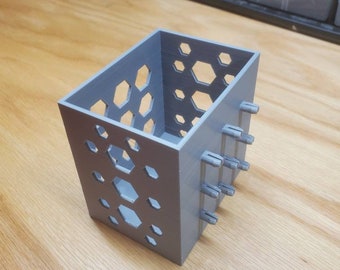 Pegboard box with hexagon cutouts