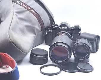 Canon A-1 Black Slr Film Camera w/ Canon FD 50mm f1.4 VMC Vivitar Series 1 70-210mm f/3.5 Macro Vivitar 2x Macro Focusing Teleconverter lens