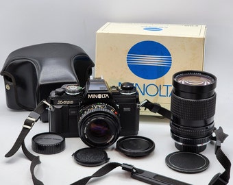 Minolta X-700 SLR Film Camera w/ MD 50mm f2 Lens & Cosina 28-85mm F4-5 Lens, Case, Box