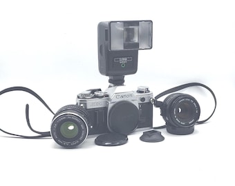 Canon AE-1 35mm film camera w/ Canon FD 50mm f/1.8, Super Albinar Auto f2.8 28mm, Sunpak Auto 221 S Flash