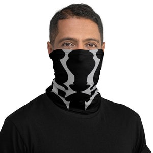May include: A black face mask with a gray skull design. The mask is made of a soft, breathable fabric and is comfortable to wear.