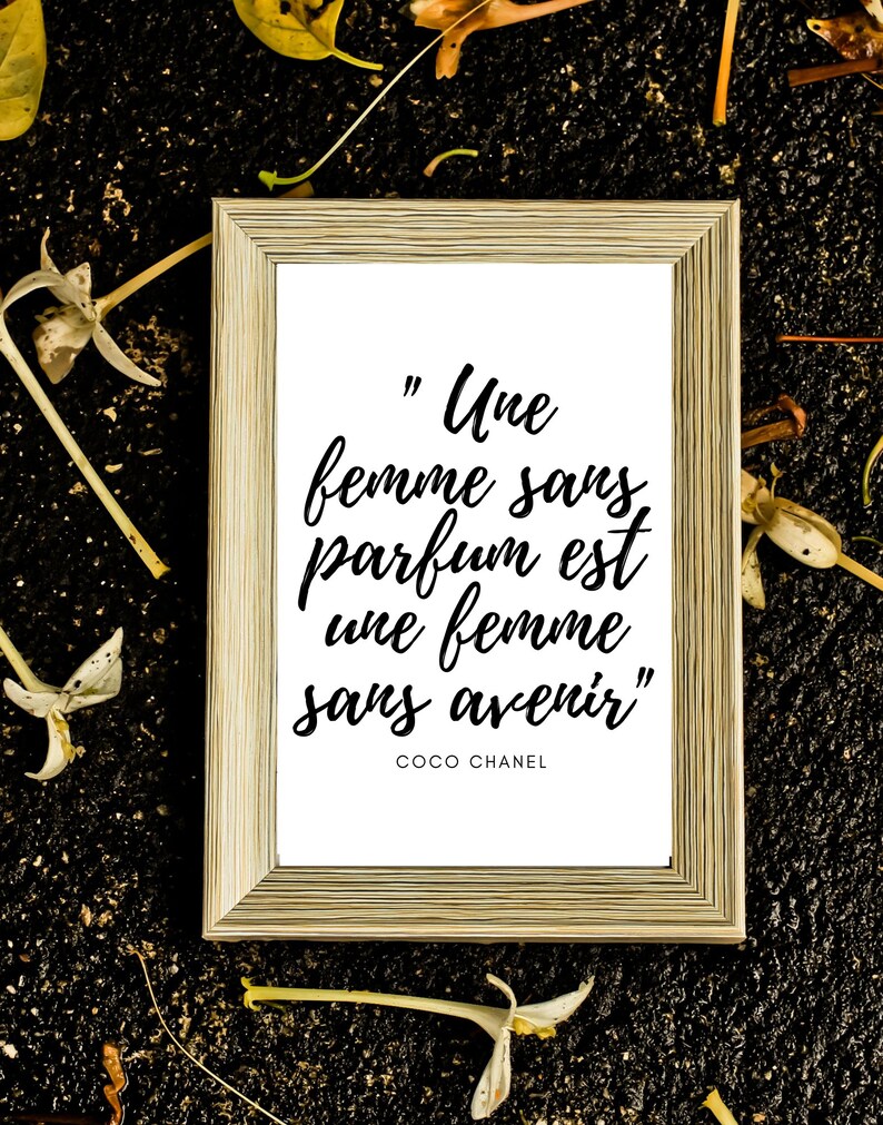 May include: A framed print with a white background and black text that reads "Une femme sans parfum est une femme sans avenir" by Coco Chanel.