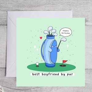 May include: A green card with a cartoon golf bag holding golf clubs and a red flag. The golf bag has a smiling face and says "Happy Birthday". The text below the golf bag says "best boyfriend by par".