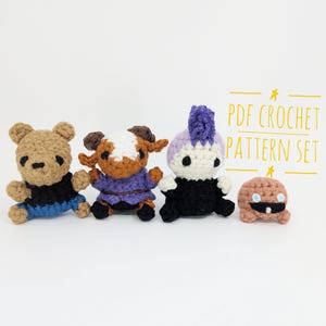 May include: A collection of four handmade crochet amigurumi dolls. The dolls include a brown bear, a cow with a white face, a doll with a purple mohawk, and a small brown creature. The text "PDF CROCHET PATTERN SET" is written in yellow.