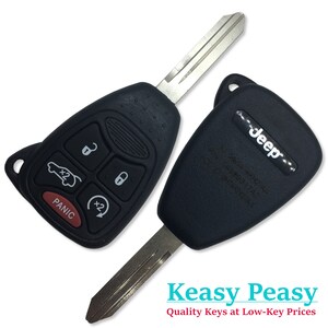 Like New O.E.M Jeep Commander & Liberty Remote Fob Uncut Key Fob FCC - OHT692427 PN -68003389