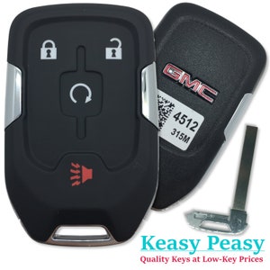 May include: Black key fob with silver trim and four buttons. The buttons are labelled with lock, unlock, and a circular arrow. The fob also has a red speaker icon. The key fob has a GMC logo and the text "4512 315M".