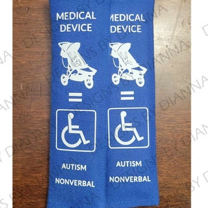 May include: Two blue fabric wristbands with white text and symbols. The text reads "Medical Device" and "Autism Nonverbal". Each wristband features a white wheelchair symbol and a white stroller symbol.