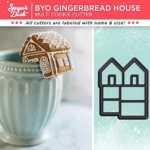 May include: A black gingerbread house cookie cutter with a double-door design and multiple windows. The cutter is shown next to a gingerbread house cookie.