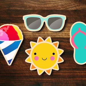 May include: Four summer-themed stickers on a wood background. The stickers are a pink, red, and yellow snow cone, a pair of blue sunglasses, a yellow sun with a smiling face, and a blue flip-flop.