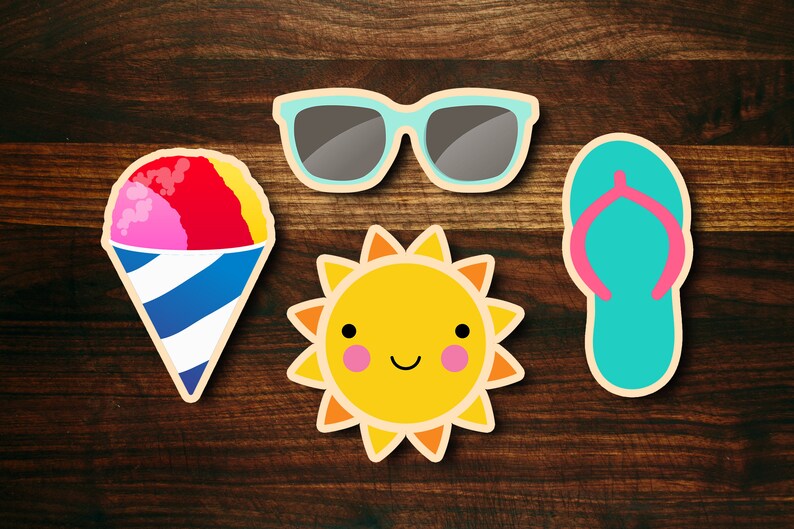 May include: Four summer-themed stickers on a wood background. The stickers are a pink, red, and yellow snow cone, a pair of blue sunglasses, a yellow sun with a smiling face, and a blue flip-flop.