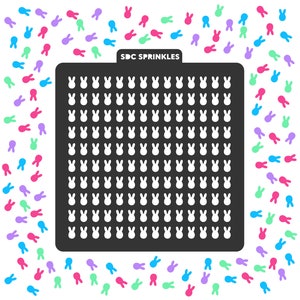 May include: Black stencil with a grid of bunny shapes. The stencil is surrounded by a border of colorful bunny shapes. The text "SDC SPRINKLES" is printed on the stencil.
