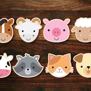 Peut inclure: Huit visages d'animaux color&eacute;s avec des expressions souriantes. Les animaux comprennent un cheval, une ch&egrave;vre, un cochon, un mouton, une vache, un raton laveur, un chat et un chien.