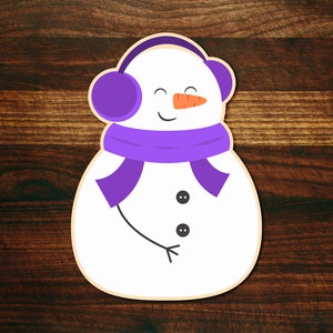 May include: A white snowman with a purple scarf and headband, wearing a purple hat with a carrot nose and smiling.