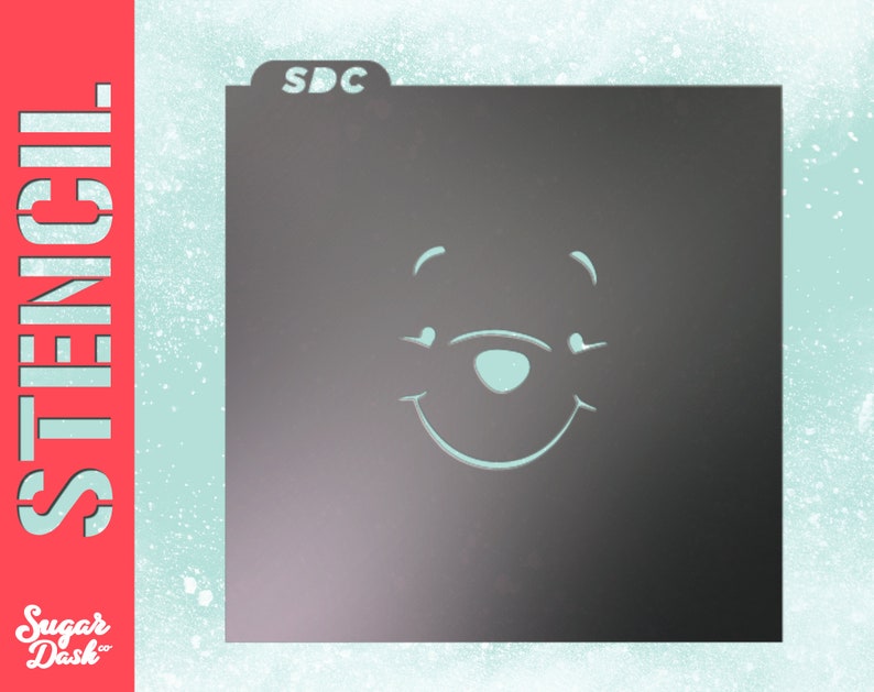 May include: A black stencil with the text "SDC" in the top left corner. The stencil features a simple outline of Winnie the Pooh's face with a smile.
