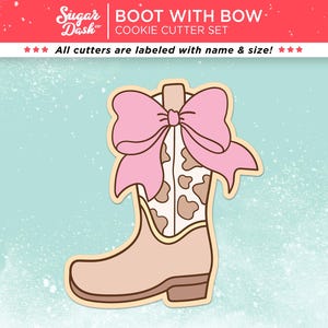 May include: A cookie cutter set featuring a cowboy boot design with a pink bow. The boot is tan with a cowhide pattern and a light brown outline. The text "BOOT WITH BOW COOKIE CUTTER SET" is at the top. All cutters are labeled with name & size!