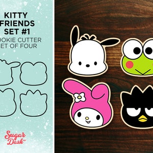 May include: A set of four cookie cutters featuring popular cartoon characters. The cutters are shaped like a black and white dog, a green frog, a pink rabbit, and a black cat. The cutters are made of metal and are designed for use with cookie dough.