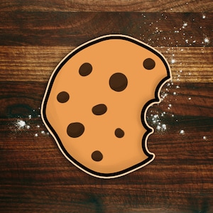 May include: A brown cookie with chocolate chips, a bite taken out of it, on a wooden surface with white powder sprinkled around it.