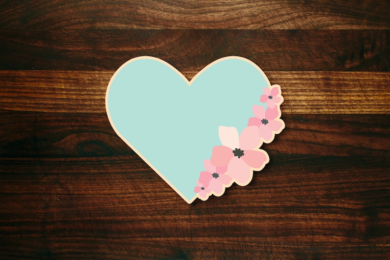 May include: A light blue heart-shaped card with pink flowers on the right side.