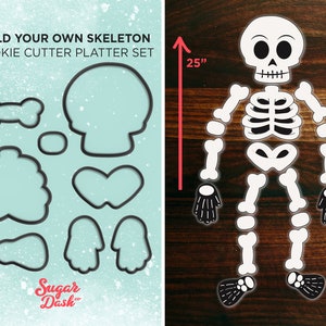 May include: Build Your Own Skeleton Cookie Cutter Platter Set, a set of 10 cookie cutters in black, featuring a skull, bones, and hands. The cutters are arranged on a light blue background with a white snowflake pattern. The set is 63.5 cm tall.
