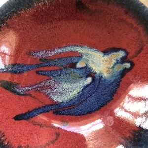 May include: A set of three ceramic mugs with a speckled, matte finish in cream, light grey, and dark grey. Each mug has a simple, minimalist design, ideal for tea or coffee.