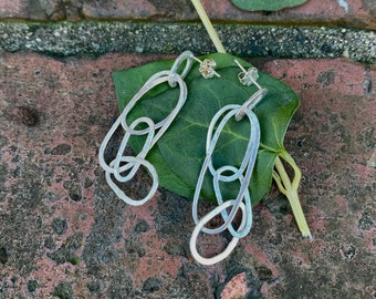 Handcrafted sterling silver long dangle earrings - four shapes combined to create movement and interest