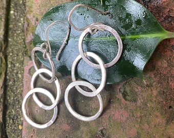 Hand crafted sterling silver earrings - interlacing circles- great movement.