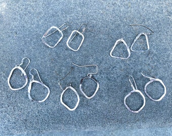 Handcrafted sterling silver dangling earrings in various shapes