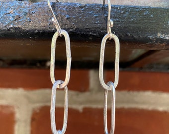 Dangling sterling silver handcrafted earrings, interlaced oblong shapes