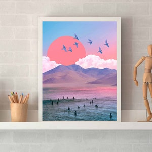 May include: A framed print of a digital collage featuring a pink sunset over a mountain range with a flock of blue birds flying overhead. The scene is set against a blue sky with white clouds.
