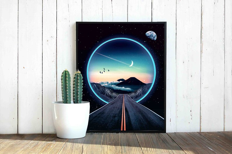 May include: A framed print of a digital art piece depicting a road leading into a glowing blue circle. The circle is set against a dark blue sky with stars and a crescent moon. A small planet is visible in the upper right corner.