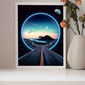 May include: A framed print of a digital art piece depicting a road leading into a glowing blue circle. The circle is set against a dark blue sky with stars and a crescent moon. The road is surrounded by mountains and clouds.