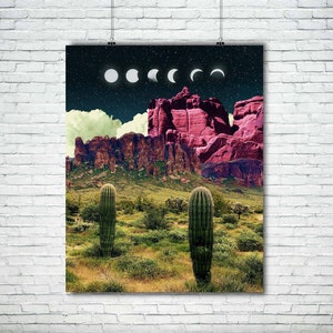 May include: A digital art print featuring a desert landscape with a pink mountain range, two cacti, and a night sky with a crescent moon and stars.