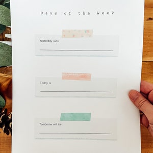 May include: A printable worksheet with the text "Days of the Week" at the top. There are three blank lines with the text "Yesterday was", "Today is", and "Tomorrow will be" above each line.