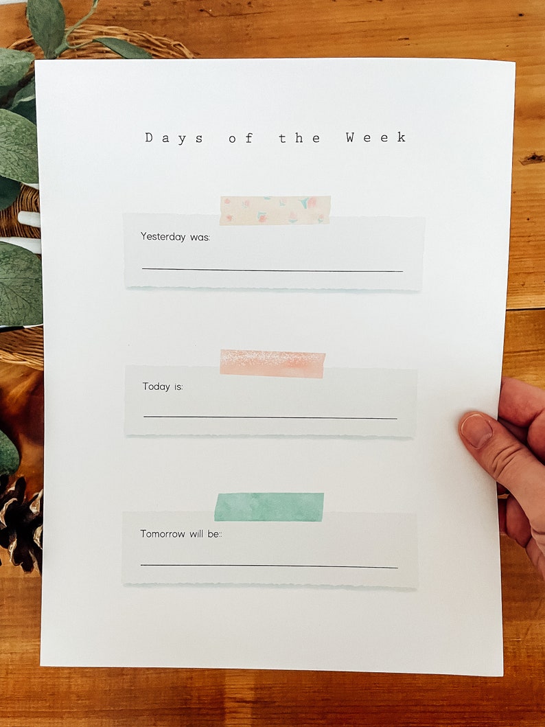 May include: A printable worksheet with the text "Days of the Week" at the top. There are three blank lines with the text "Yesterday was", "Today is", and "Tomorrow will be" above each line.