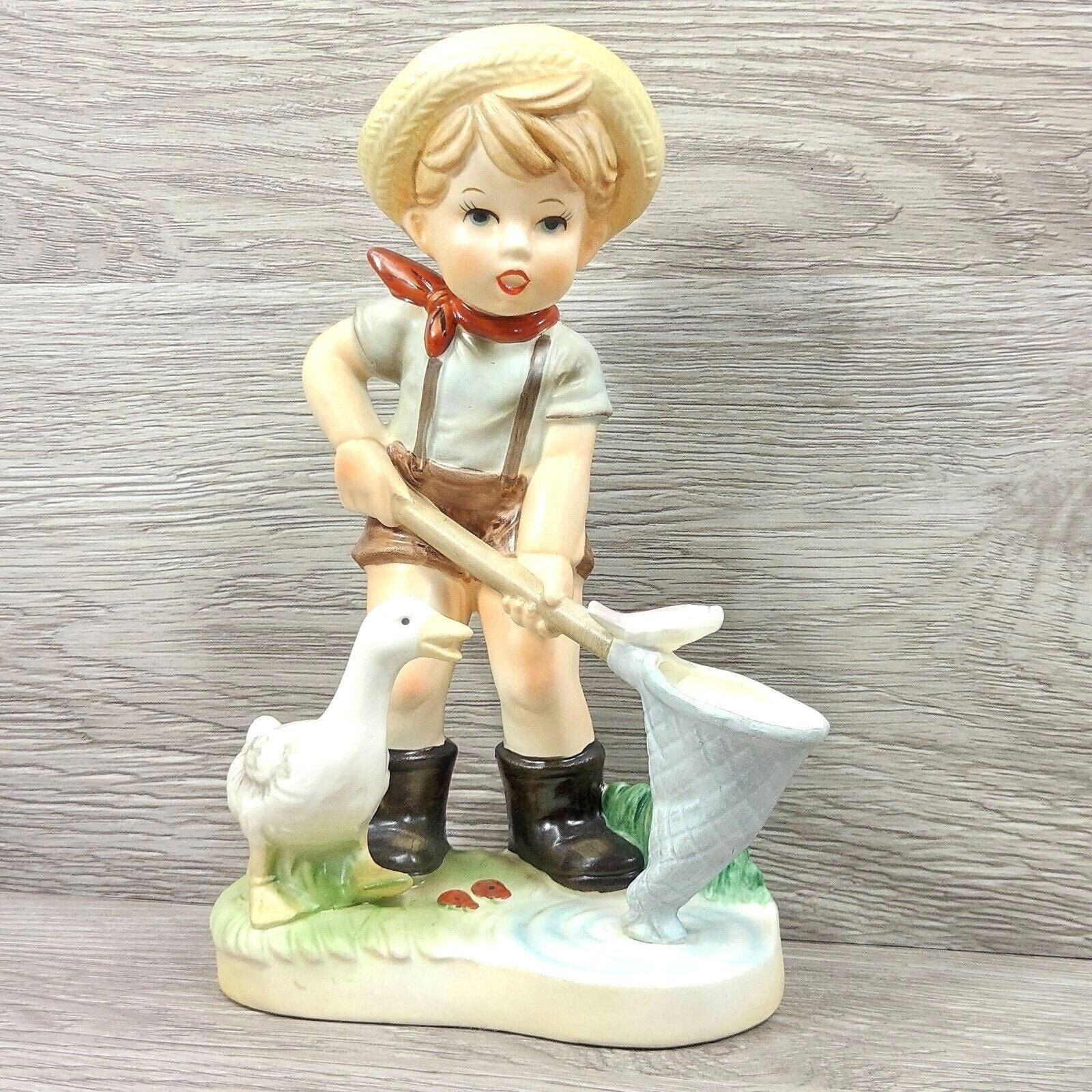 Vintage Porcelain Farm Boy Figurine Fisherman Boy Goose and a Fish