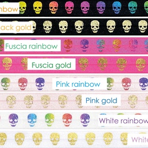 May include: A set of eight elastic hair ties with a skull design. The hair ties are available in black, fuchsia, pink, and white. Each color has a rainbow and gold option. The hair ties are made of elastic and have a glitter finish.