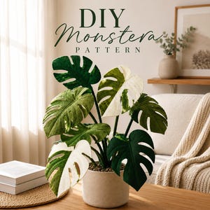 May include: A decorative Monstera plant with large, green and white variegated leaves in a neutral pot. The plant is on a wooden table. The text "DIY Monstera Pattern" is at the top of the image.