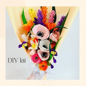 May include: A vibrant felt flower bouquet featuring pink, white, orange, yellow, and purple flowers, presented in light yellow paper and secured with a white ribbon. The text "DIY kit" is visible.