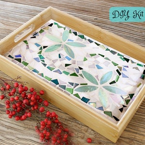 May include: A rectangular bamboo serving tray with a mosaic tile design. The mosaic features a floral pattern in shades of green, white, and iridescent tiles. The text "DIY Kit" is in a teal box in the upper right corner.