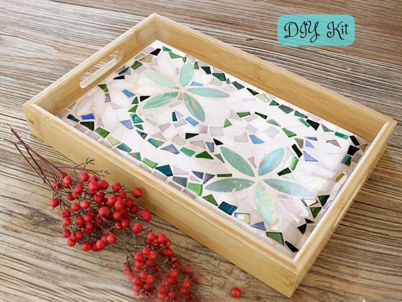 May include: A rectangular bamboo serving tray with a mosaic tile design. The mosaic features a floral pattern in shades of green, white, and iridescent tiles. The text "DIY Kit" is in a teal box in the upper right corner.